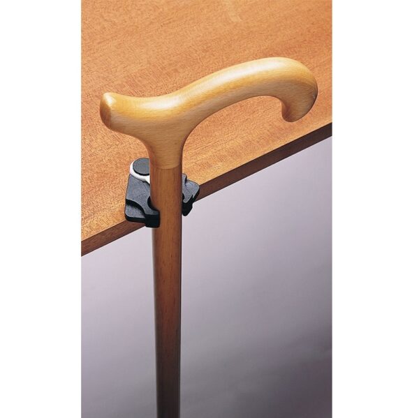 Rákapcsolható a botra, és lehetővé teszi, hogy az asztal szélén egyensúlyozzon.