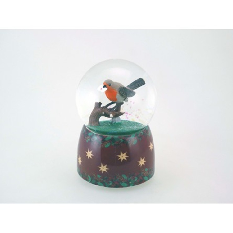 Hógömb - Vörösbegy madár. A gömb közepén egy gyönyörűen festett, élénk piros mellényű vörösbegy ül egy barna faágon.